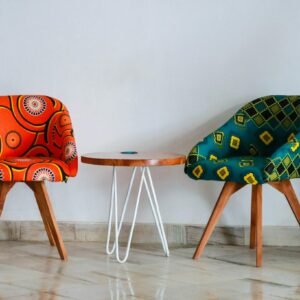 Brightly colored modern chairs and table in a minimalist room for vibrant decor ideas.